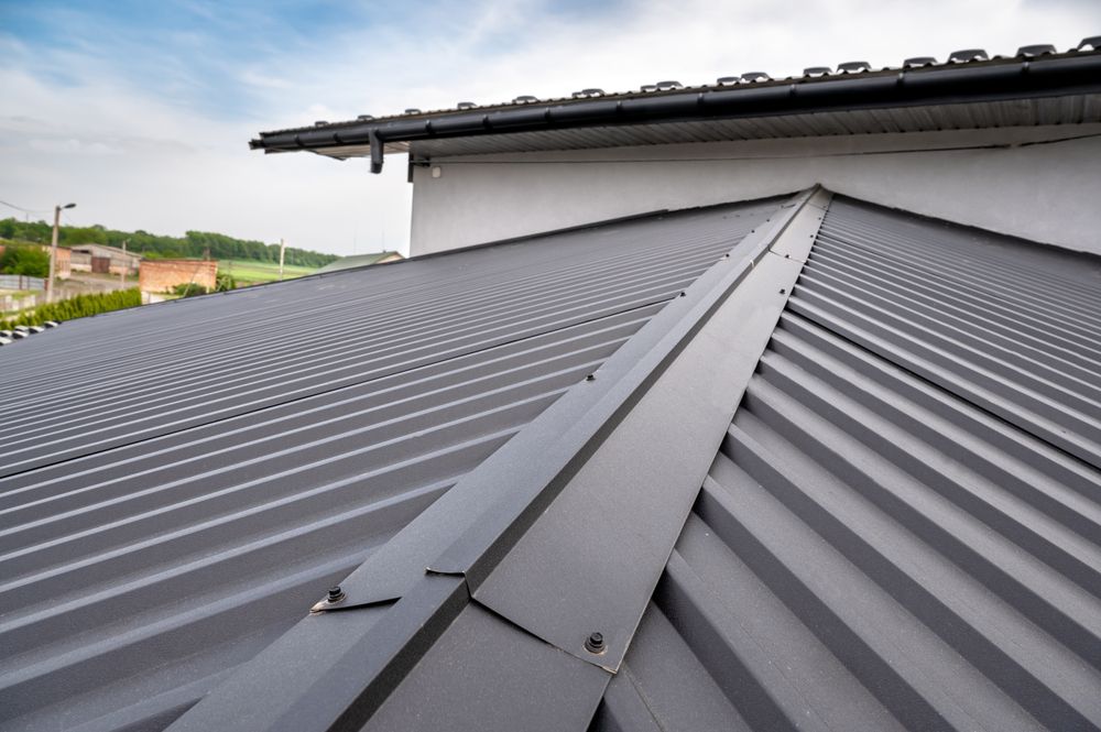 A Close Up of a Metal Roof on a House — Norwest Roof Restorations In Blue Bay, NSW