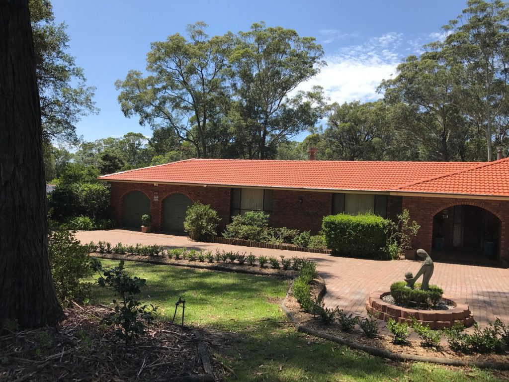 A Close Up of a Roof With Red Tiles on It — Norwest Roof Restorations In Blue Bay, NSW