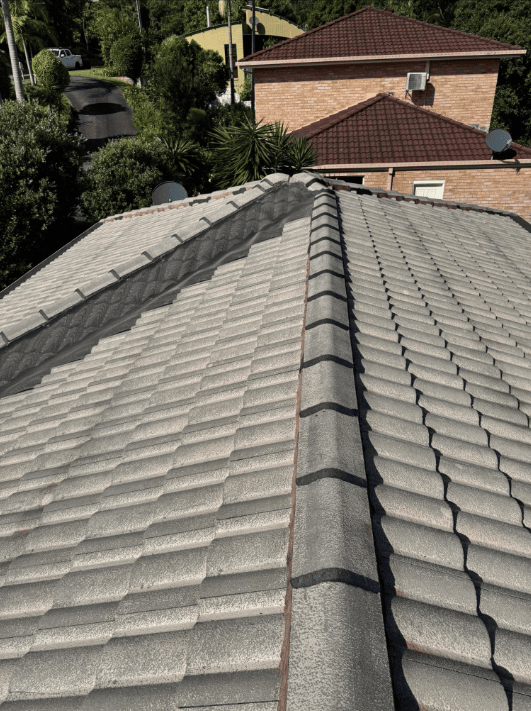 A Grey Tiled Roof — Norwest Roof Restorations In Blue Bay, NSW