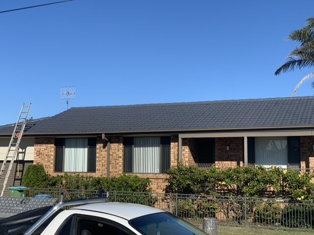 Single-story Brick House With Dark Roof — Norwest Roof Restorations In Blue Bay, NSW