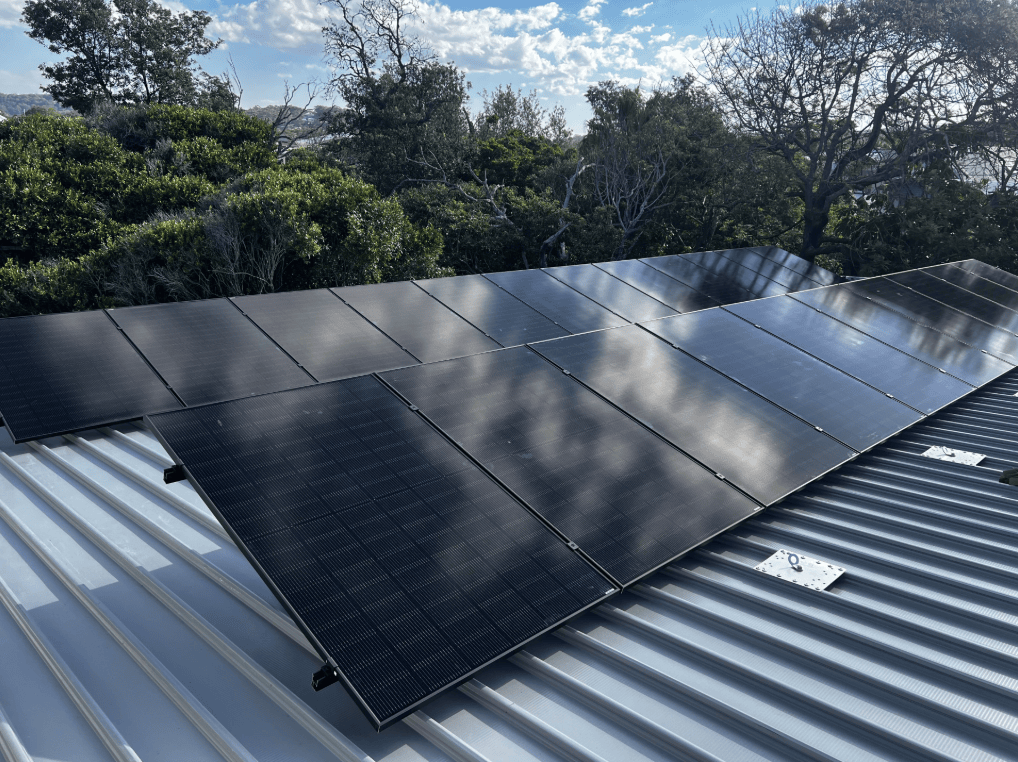 Solar Panels Mounted on a Metal Roof — Norwest Roof Restorations In Blue Bay, NSW