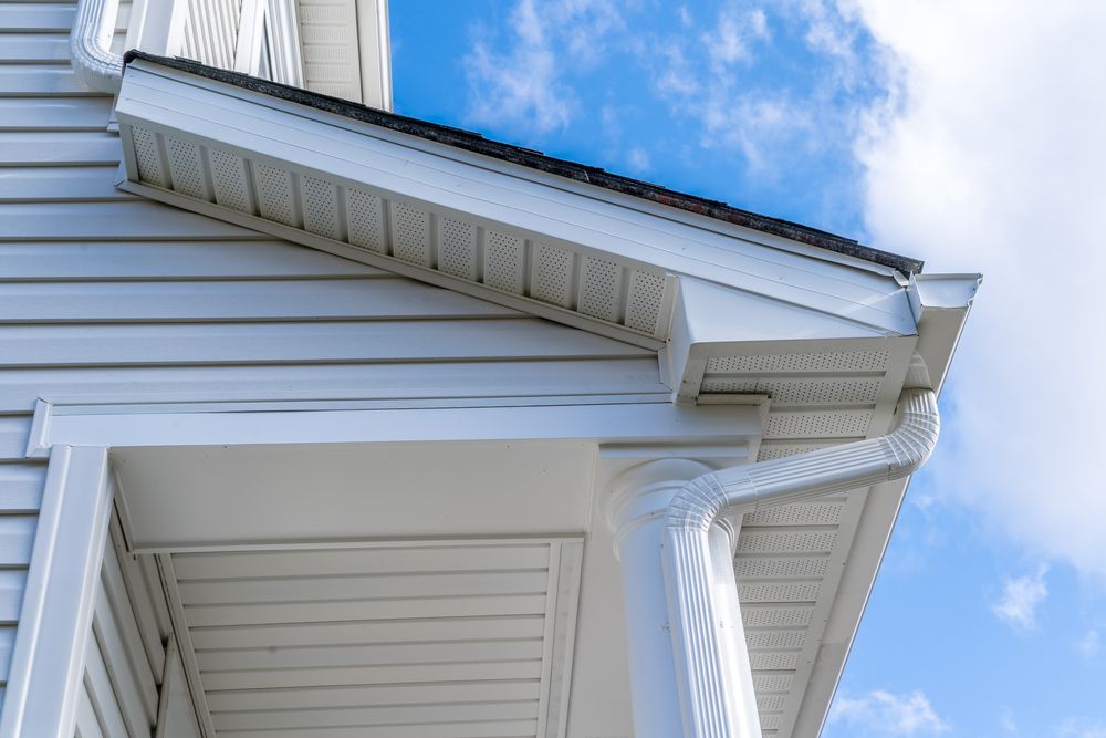 The Roof of a White House With a Blue Sky — Norwest Roof Restorations In Blue Bay, NSW