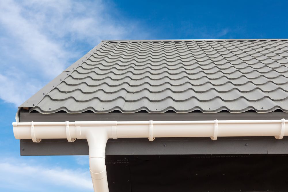 Tiled Roof With White Gutter and Downspout — Norwest Roof Restorations In Newcastle, NSW