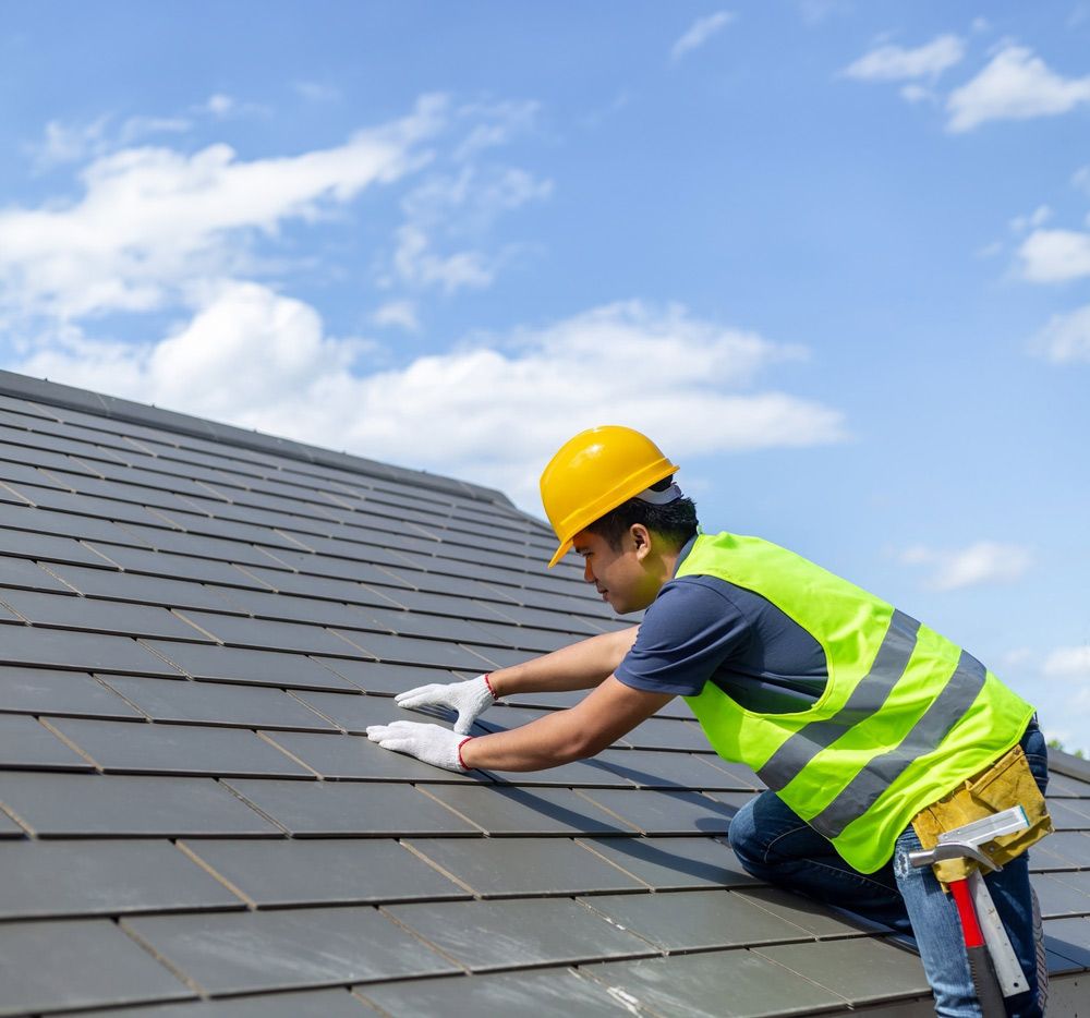 Worker in Hard Hat and Safety Vest Installing Roof Shingles — Norwest Roof Restorations In Blue Bay, NSW